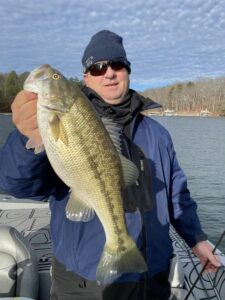 a client holding a large bass